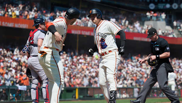 SF Giants infielder Wilmer Flores celebrates with outfielder Austin Slater after hitting a two run home run against the Atlanta Braves during the third inning at Oracle Park on August 26, 2023.
